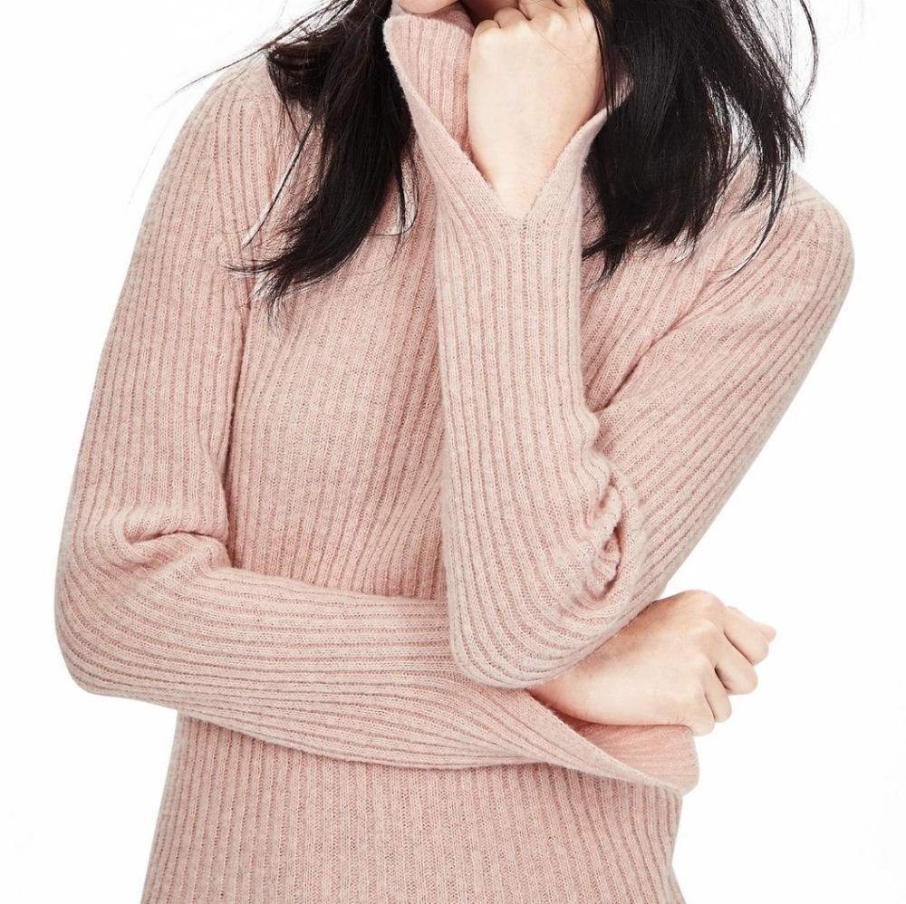 Pink ribbed turtleneck sweater